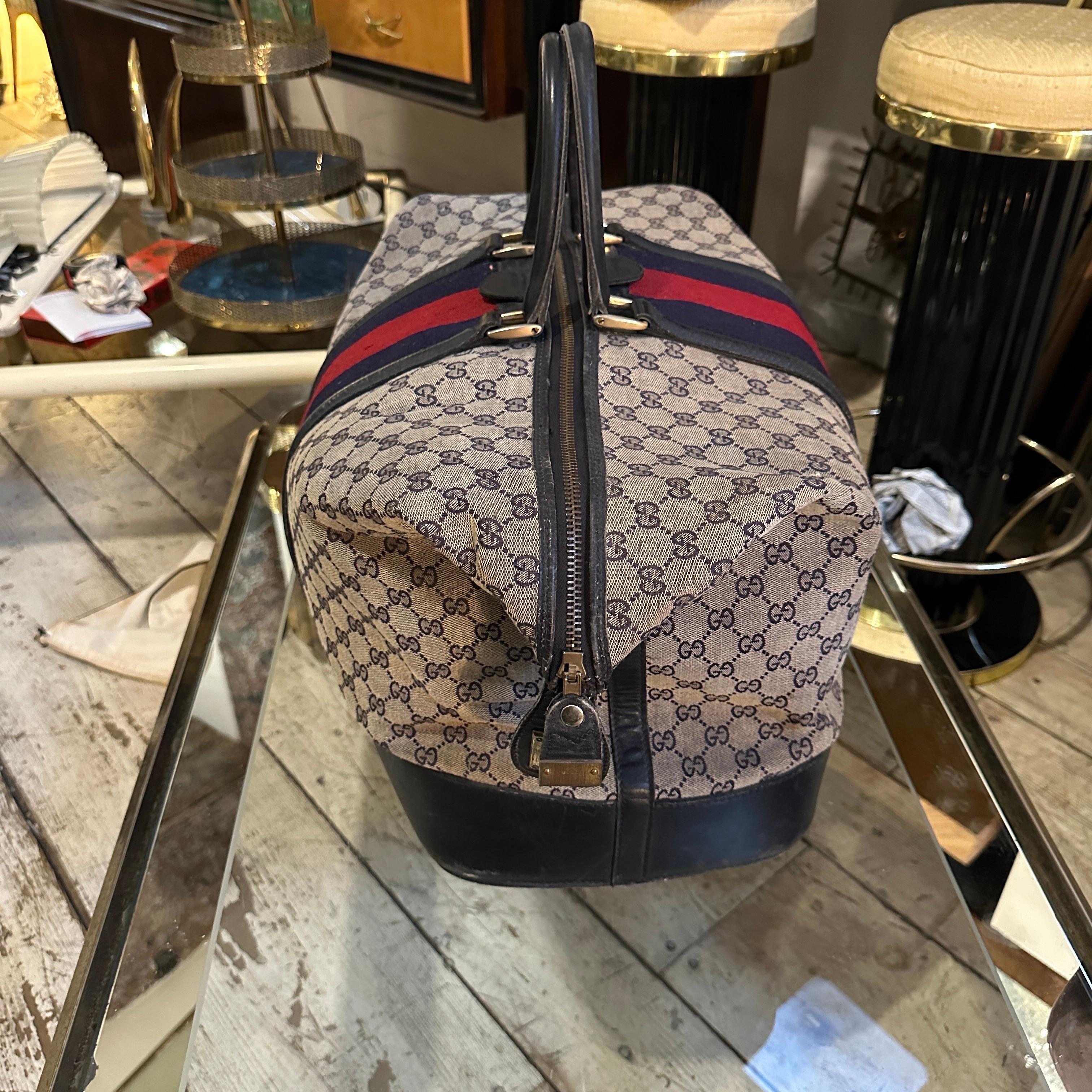 An Iconic 1980s Gucci Monogram Travel Bag with Signature Red and Blue Web Stripe In Good Condition In Aci Castello, IT