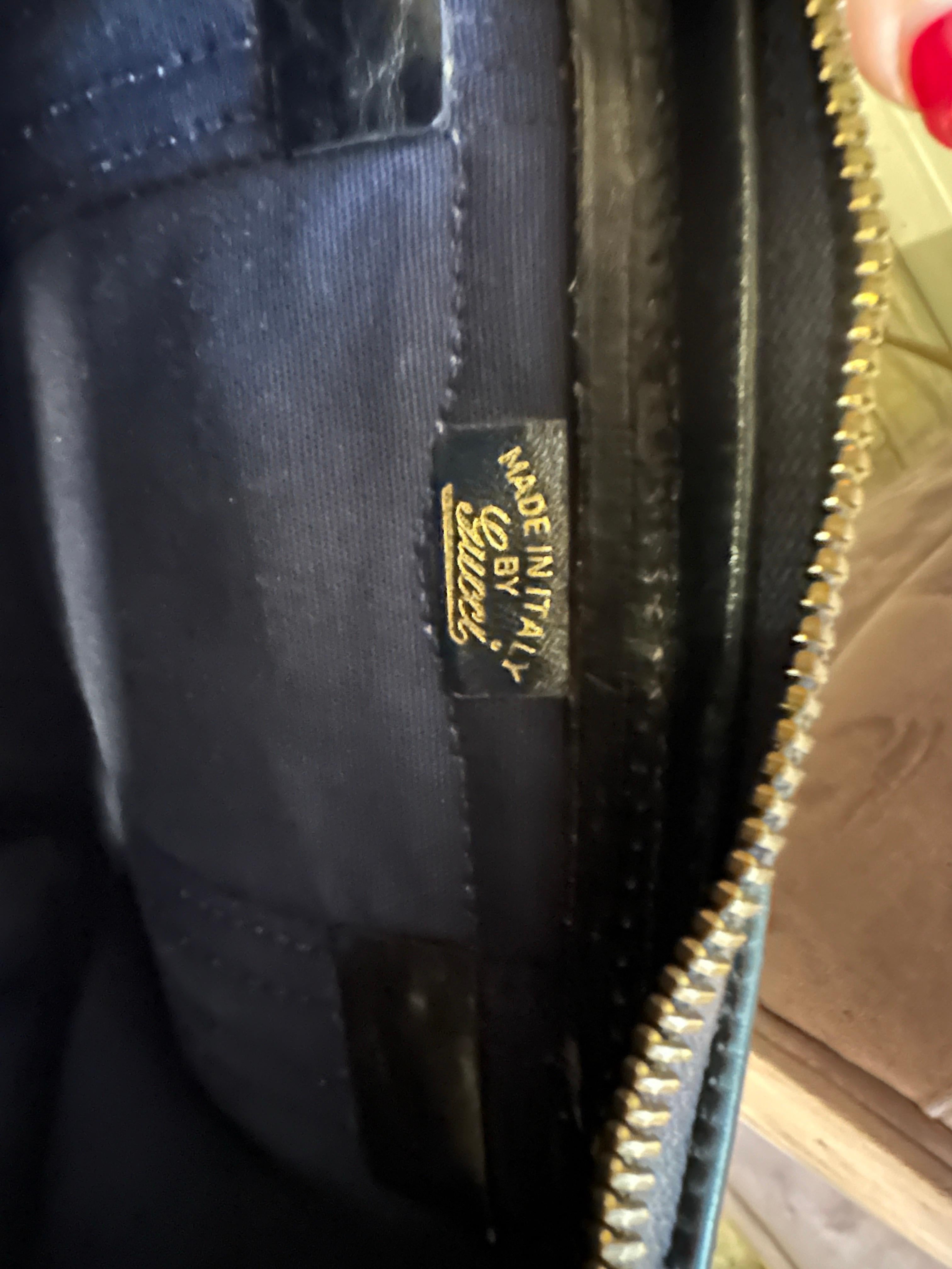 An Iconic 1980s Gucci Monogram Travel Bag with Signature Red and Blue Web Stripe 1
