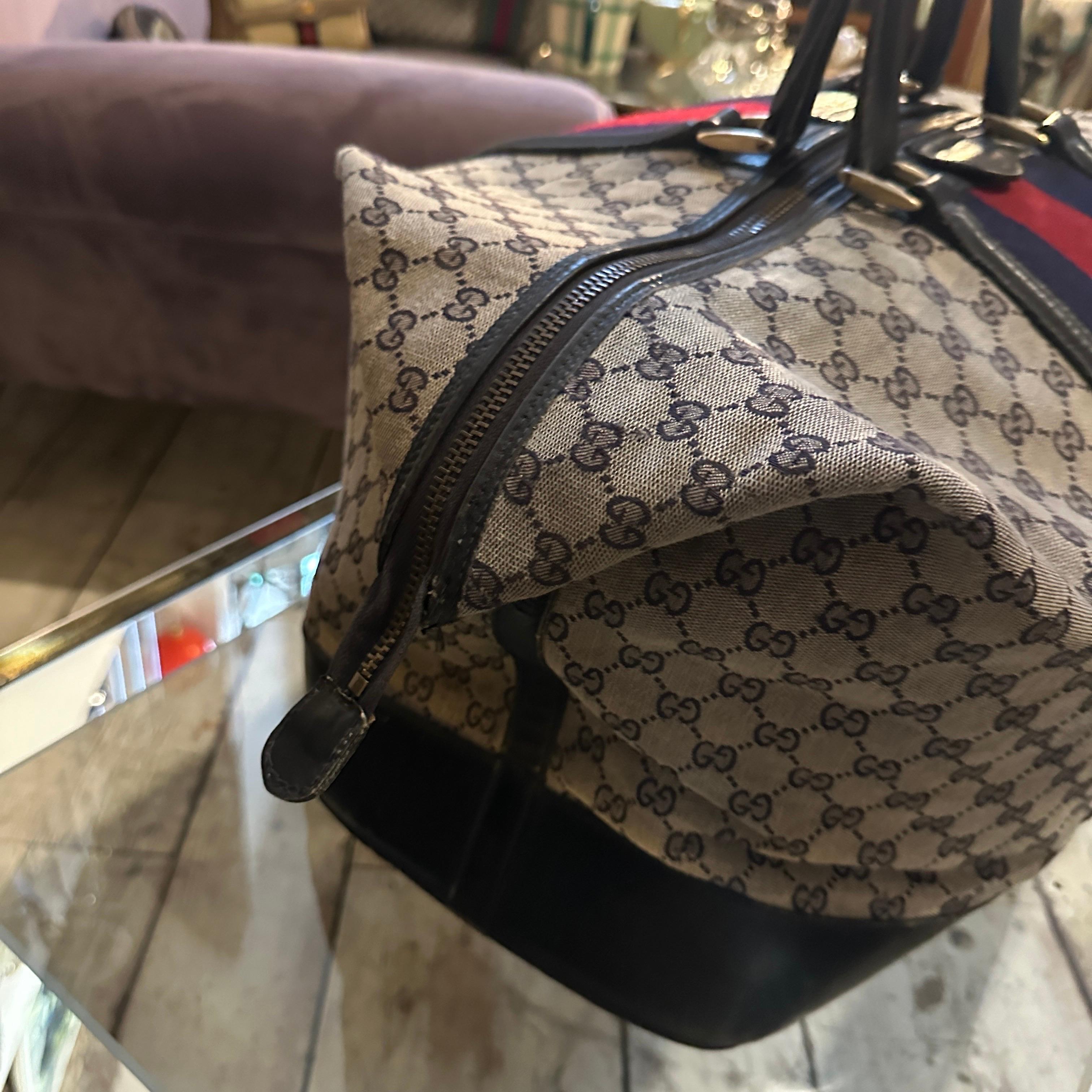 An Iconic 1980s Gucci Monogram Travel Bag with Signature Red and Blue Web Stripe 3