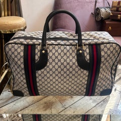 An Iconic 1980s Gucci Vintage Monogram Canvas Travel Bag