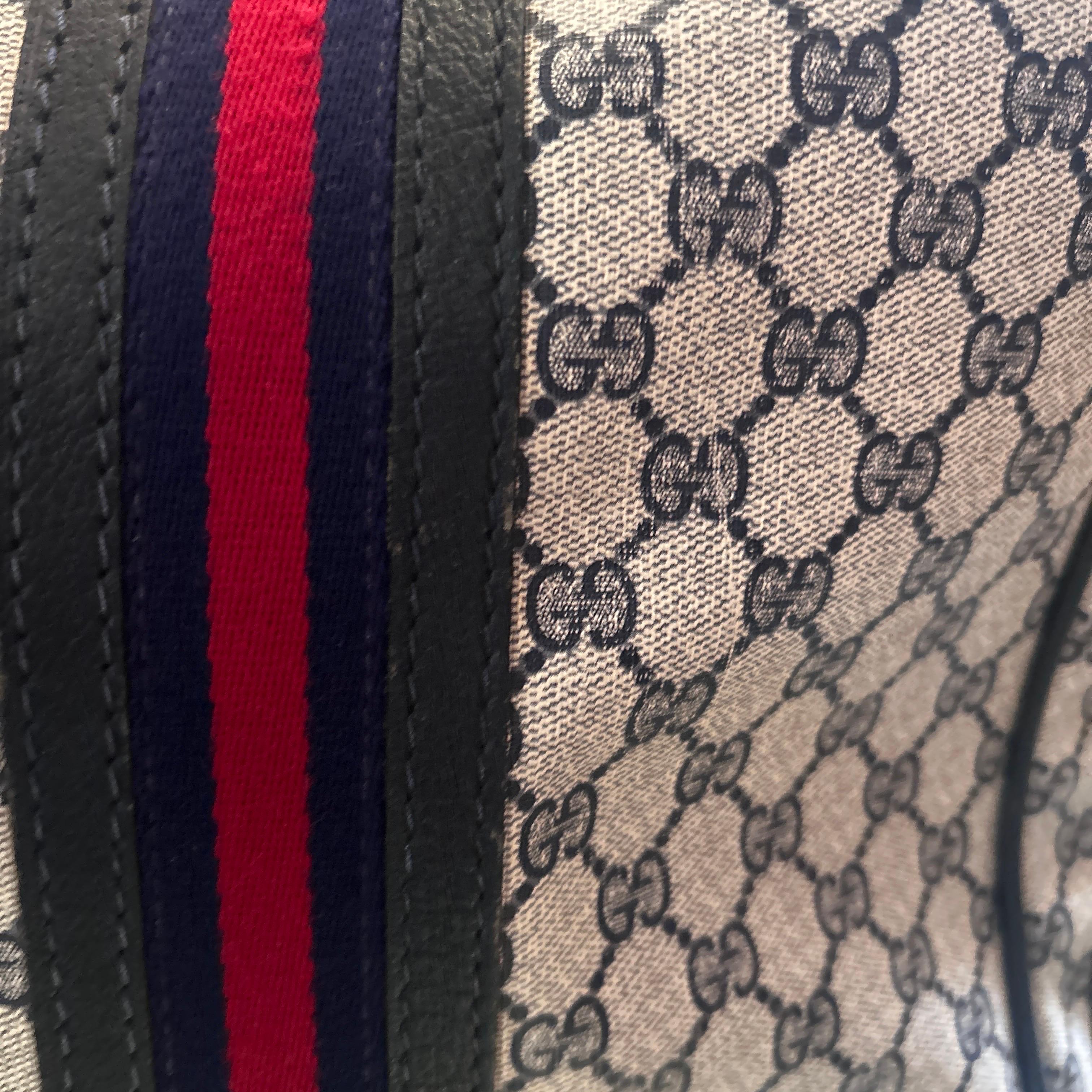 Gray An Iconic 1980s Gucci Vintage Monogram Canvas Travel Bag For Sale