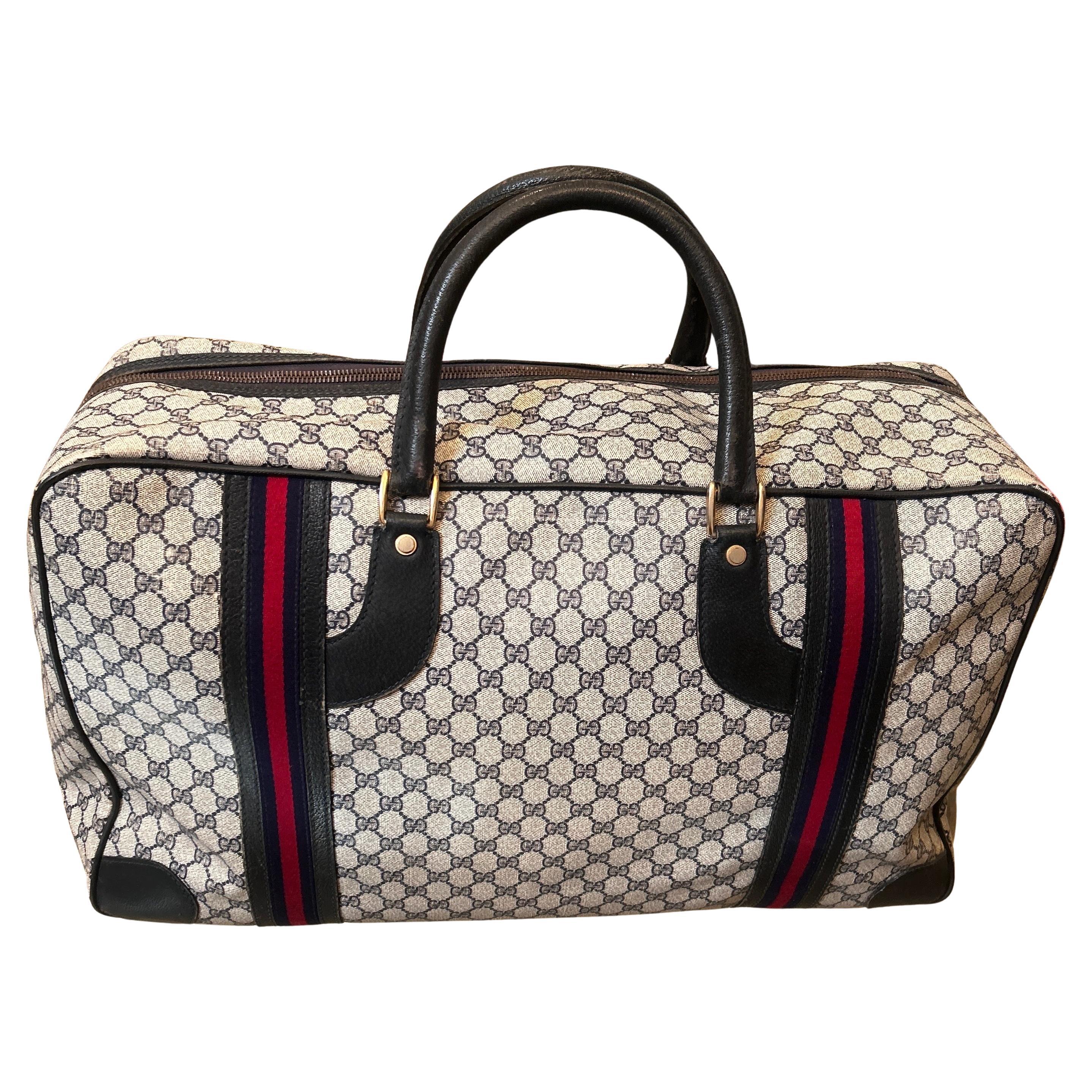 An Iconic 1980s Gucci Vintage Monogram Canvas Travel Bag For Sale