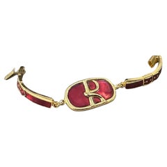 An Iconic 1990s Brass and Red Enamel Bracelet by Roberta di Camerino