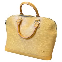An Iconic 2007 Louis Vuitton Alma Yellow Epi Leather Hand-Bag