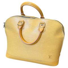 An Iconic 2007 Louis Vuitton Alma Yellow Epi Leather Hand-Bag