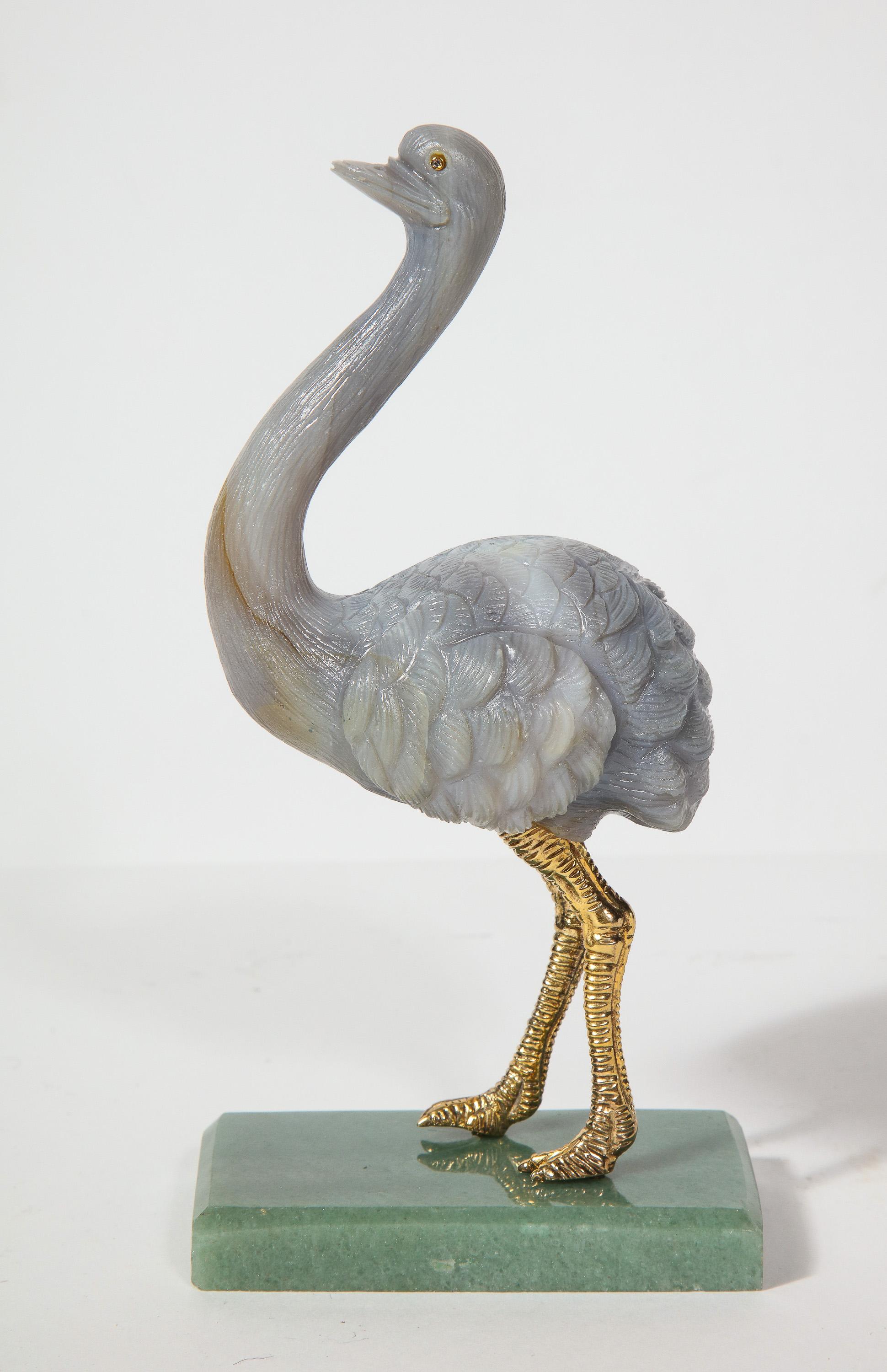 An imperial Faberge carved Labradorite ostrich on nephrite base, 20th century.

The ostrich legs are 925 silver (stamped)

In original box. Limited Edition: 18/250

Measures: 7