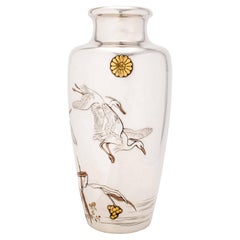 An imperial silver vase with egrets in flight signed Shoshu Sai