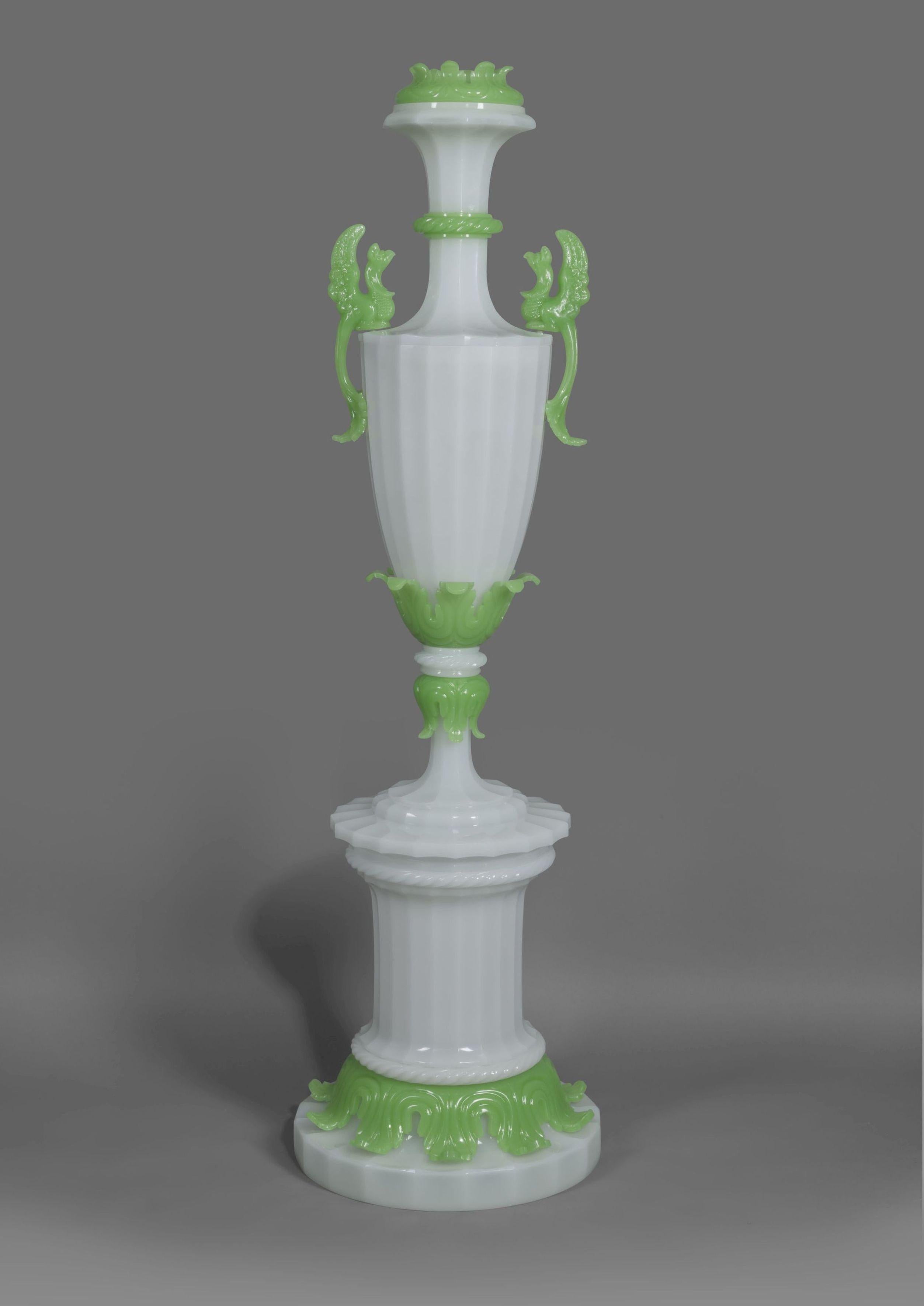 An important and monumental Louis-Philippe Verre opaline vase.

French, circa 1830.

Standing at almost 54 inches (136 cm) this impressive vase is in white opaline glass with perching birds and foliate borders fashioned in jade green.

Opaline