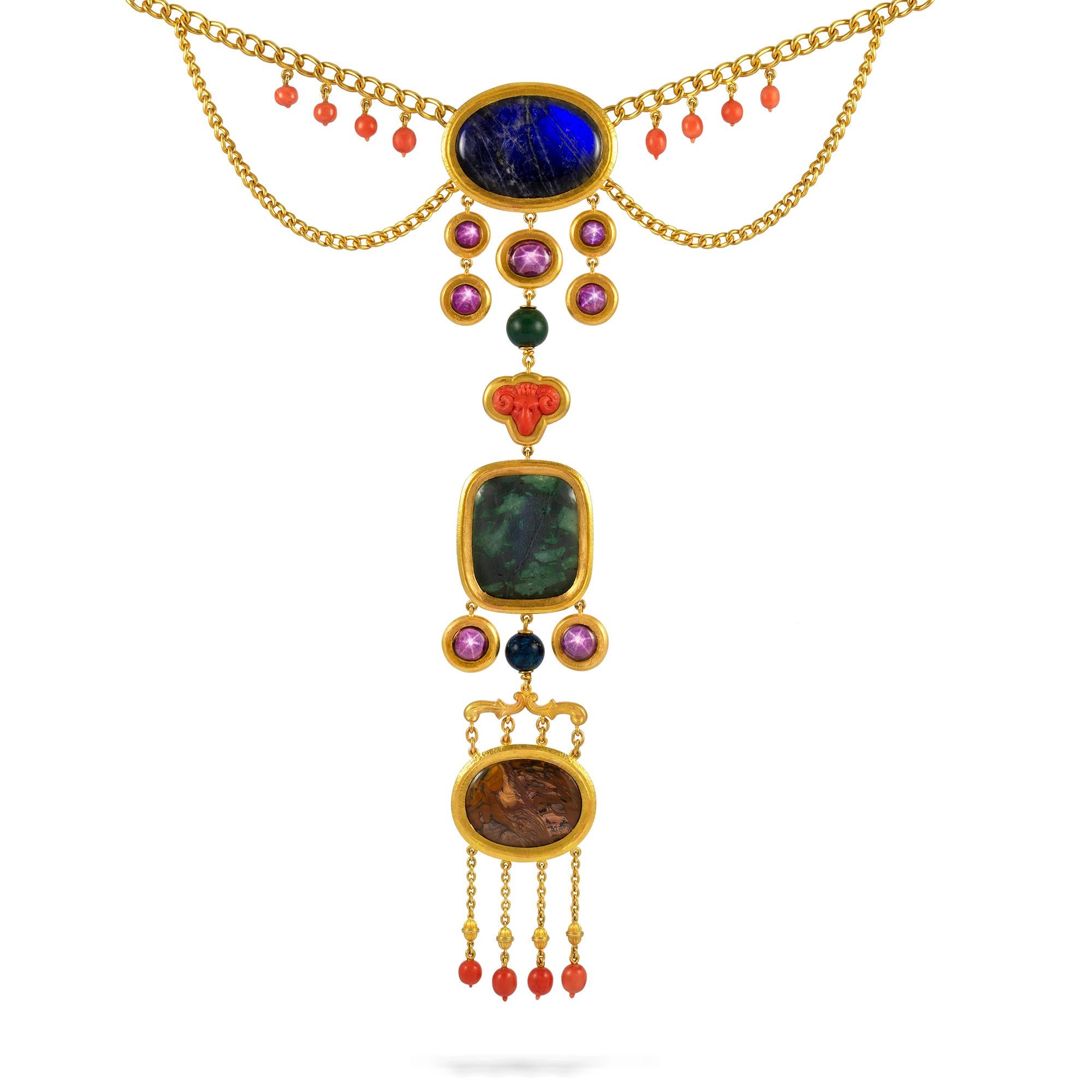 An Important Archaeological Revival gem-set gold necklace, the gold chain festoons hung with eight carved corals and suspending a central oval labradorite plaque and five round-cut  star-rubies, the central star ruby suspending a prase bead, a coral