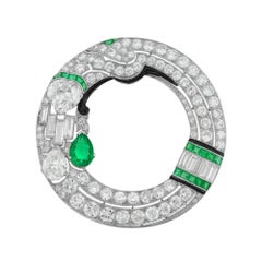 An important Art Deco diamond and emerald brooch