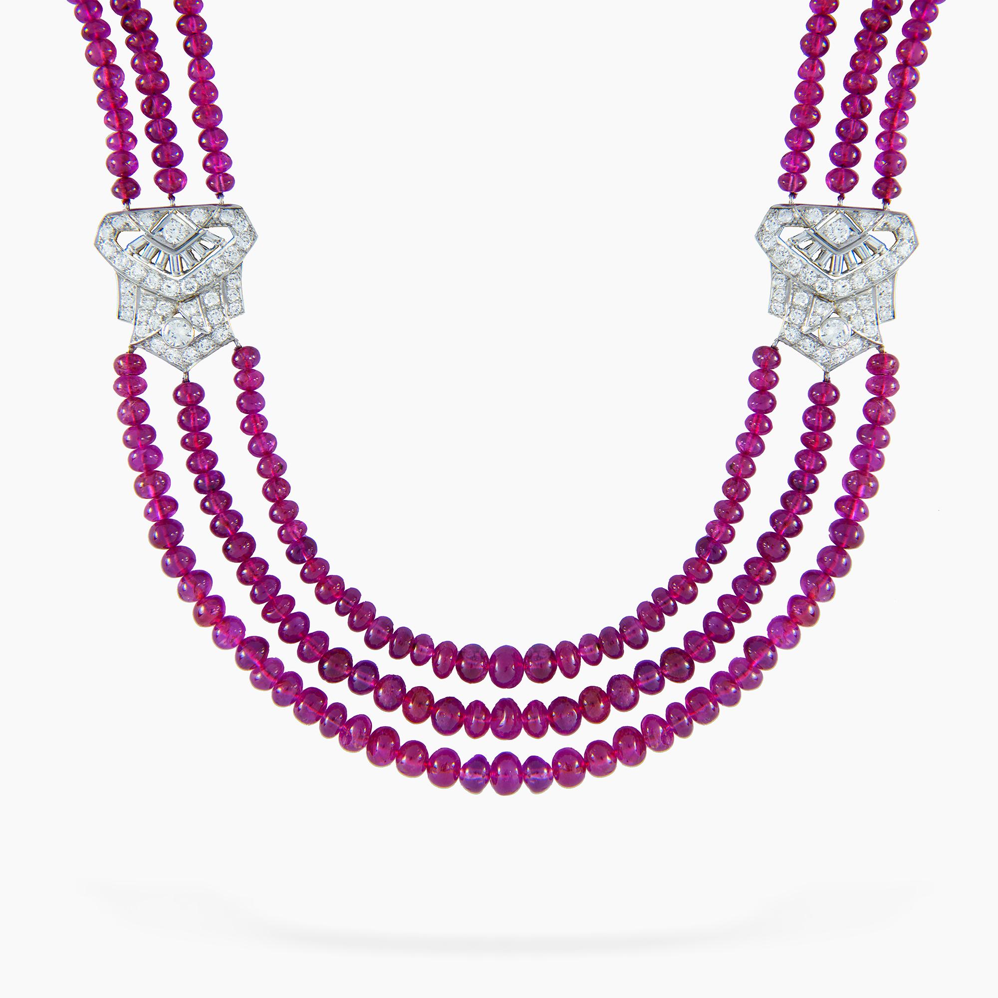 An Important Art-Deco ruby bead triple strand necklace, the three hundred and seventy one polished ruby beads weighing 223.50 carats, accompanied by GCS Report stating to be of Burmese origin with no indications of heating, graduating from the