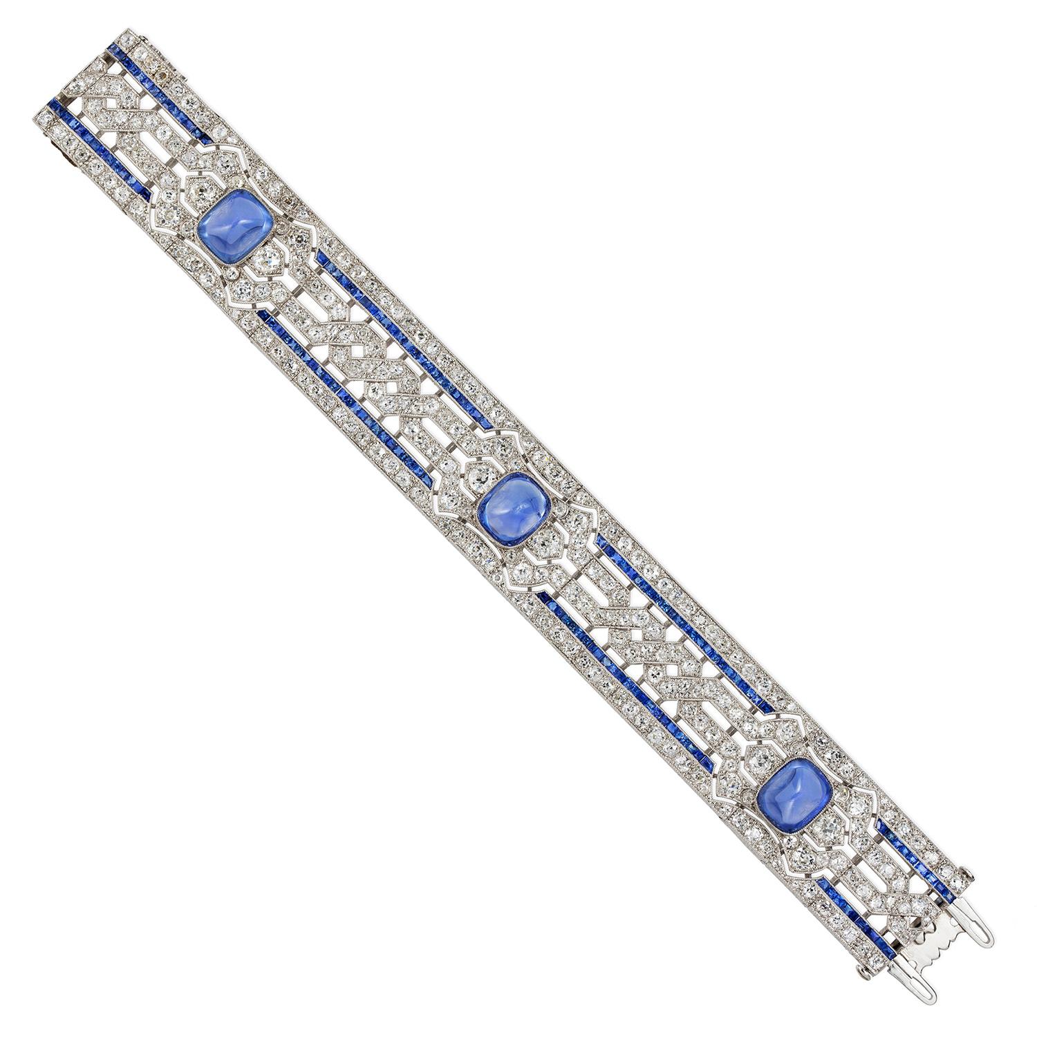 An important Art Deco sapphire and diamond bracelet, the three sugarloaf sapphires estimated to weigh 20 carats in total, accompanied by GCS report stating to be of Sri Lankan origin with no indication of heating, rub-over set to openwork mount of