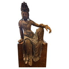 An Important Chinese Carved Wood Figure of Guanyin, Ming Dynasty, 17th Century