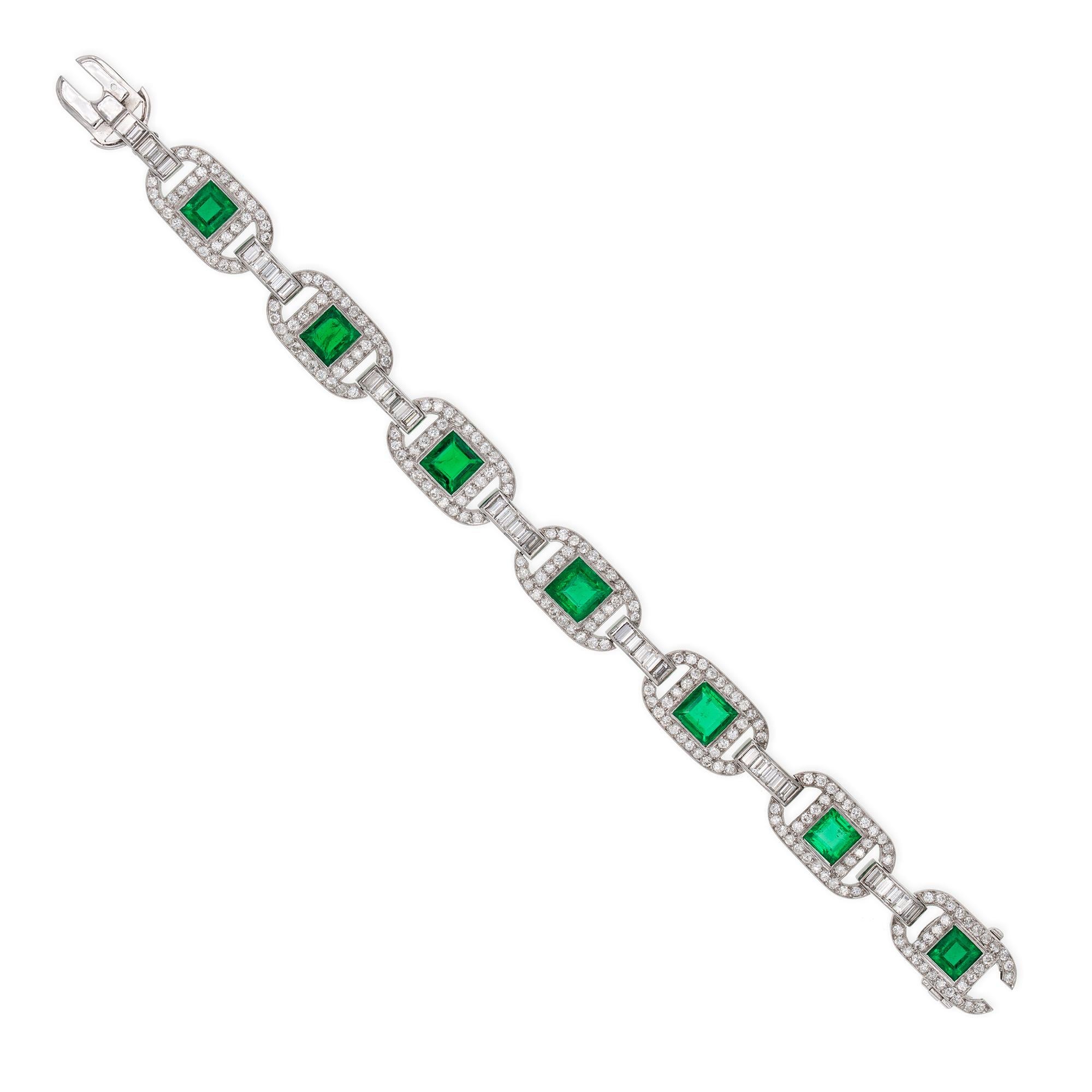 An important emerald and diamond bracelet, consisting of seven panels of elliptical shape, each centrally set with a square-cut faceted emerald to an old-cut diamond encrusted openwork surround, the panels connected with seven links, each set with
