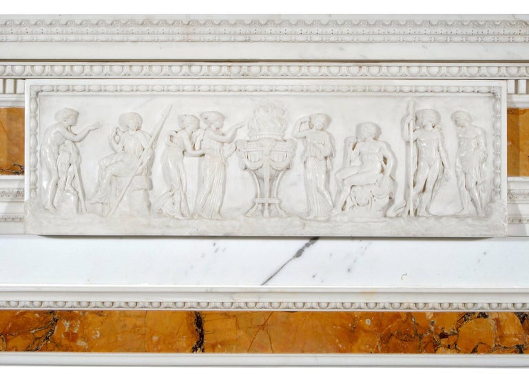 A very rare and important English 18th century (circa 1760) statuary and sienna marble fireplace with highly detailed carved centre tablet of classical figures. The jambs comprise full round tapered Sienna columns surmounted by Doric capitals. The