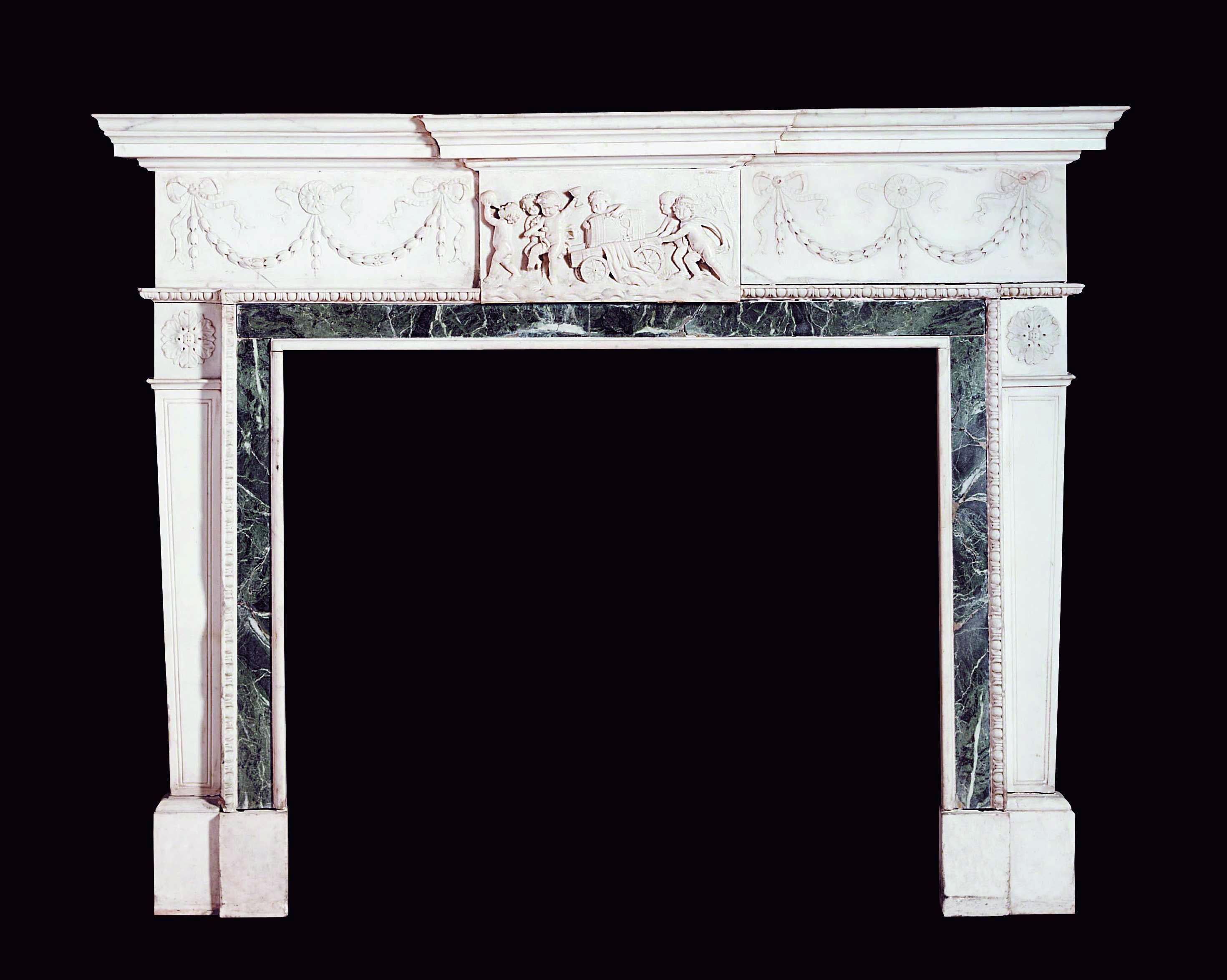 An important George III style carved white marble fireplace.

English, circa 1900.

This elegant fireplace comprises many neoclassical features, characteristic of the Georgian period. The tapered trapezoidal jambs stand on deep block feet with