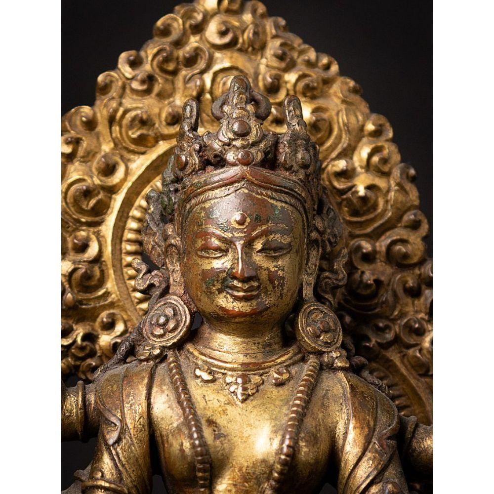 An important gild-bronze figure of Vasudhara from Nepal For Sale 4