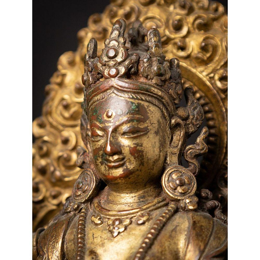 An important gild-bronze figure of Vasudhara from Nepal For Sale 9