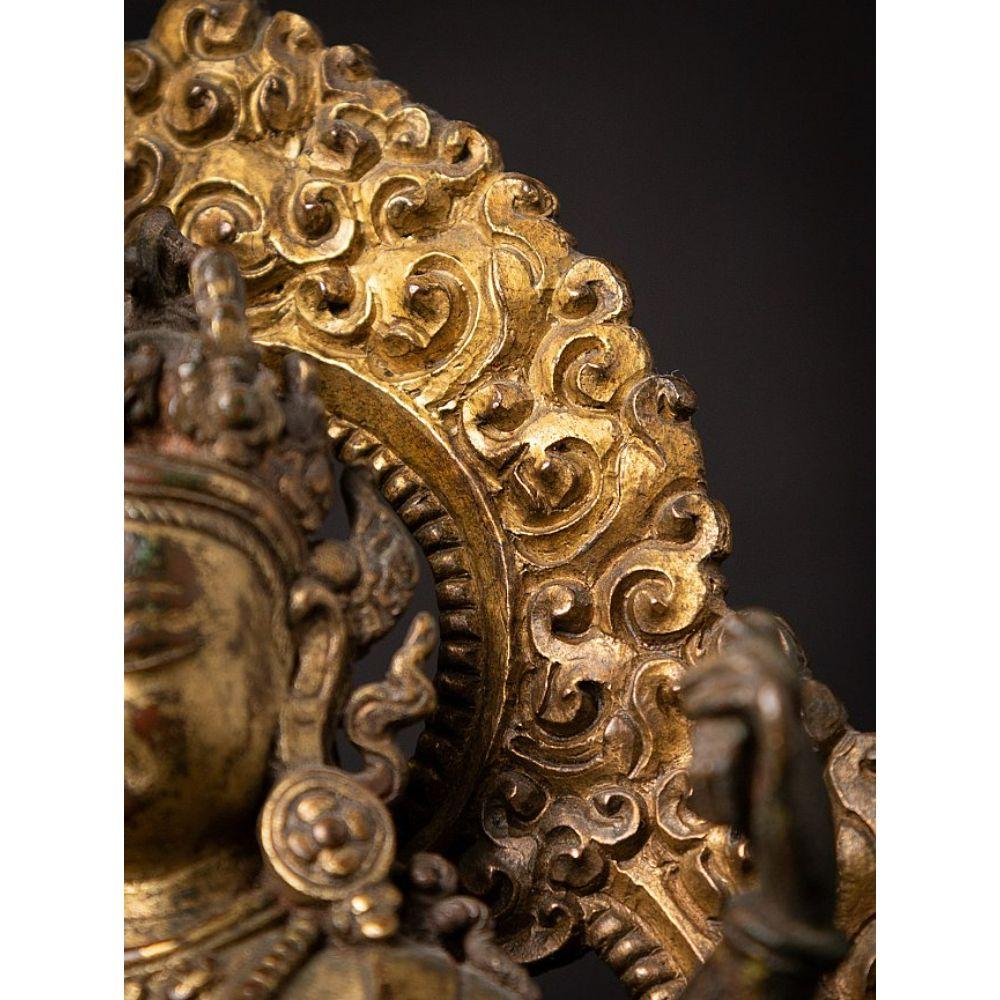 An important gild-bronze figure of Vasudhara from Nepal For Sale 10