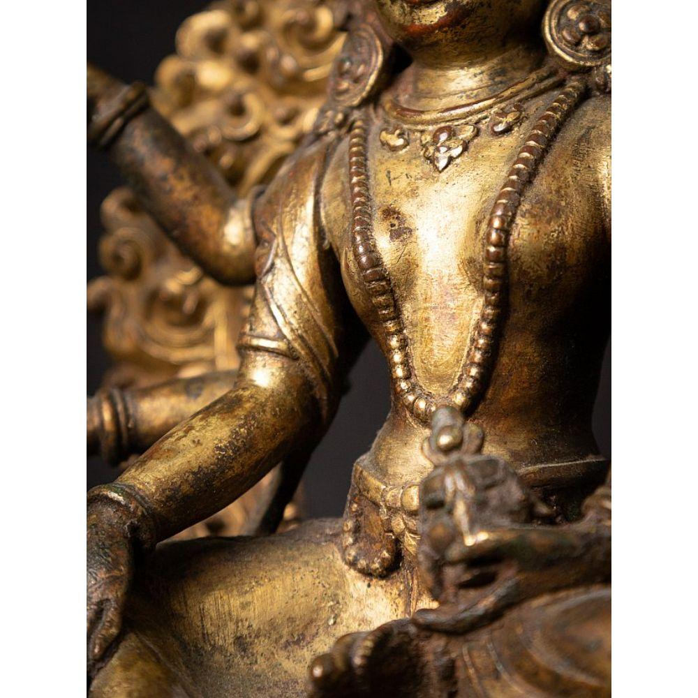 An important gild-bronze figure of Vasudhara from Nepal For Sale 11