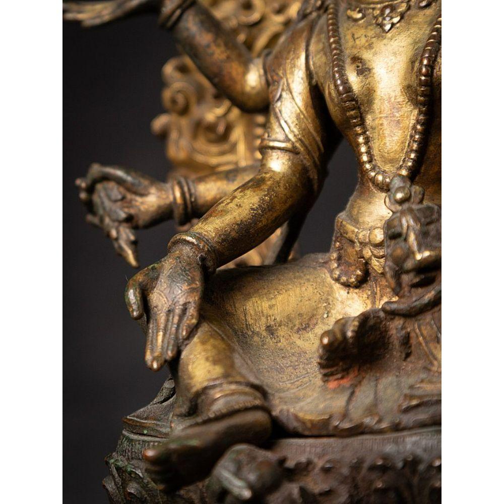 An important gild-bronze figure of Vasudhara from Nepal For Sale 13