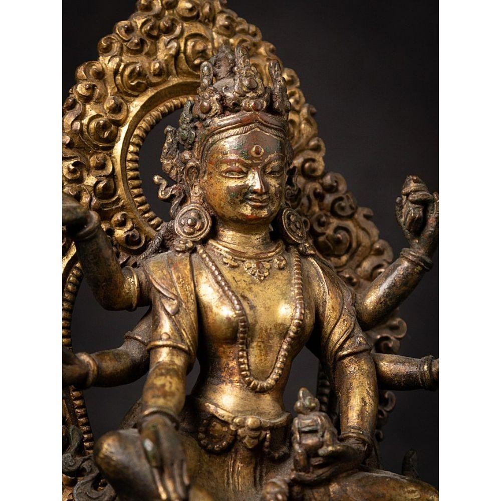 An important gild-bronze figure of Vasudhara from Nepal For Sale 1