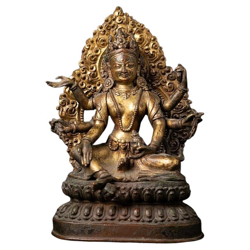 An important gild-bronze figure of Vasudhara from Nepal For Sale