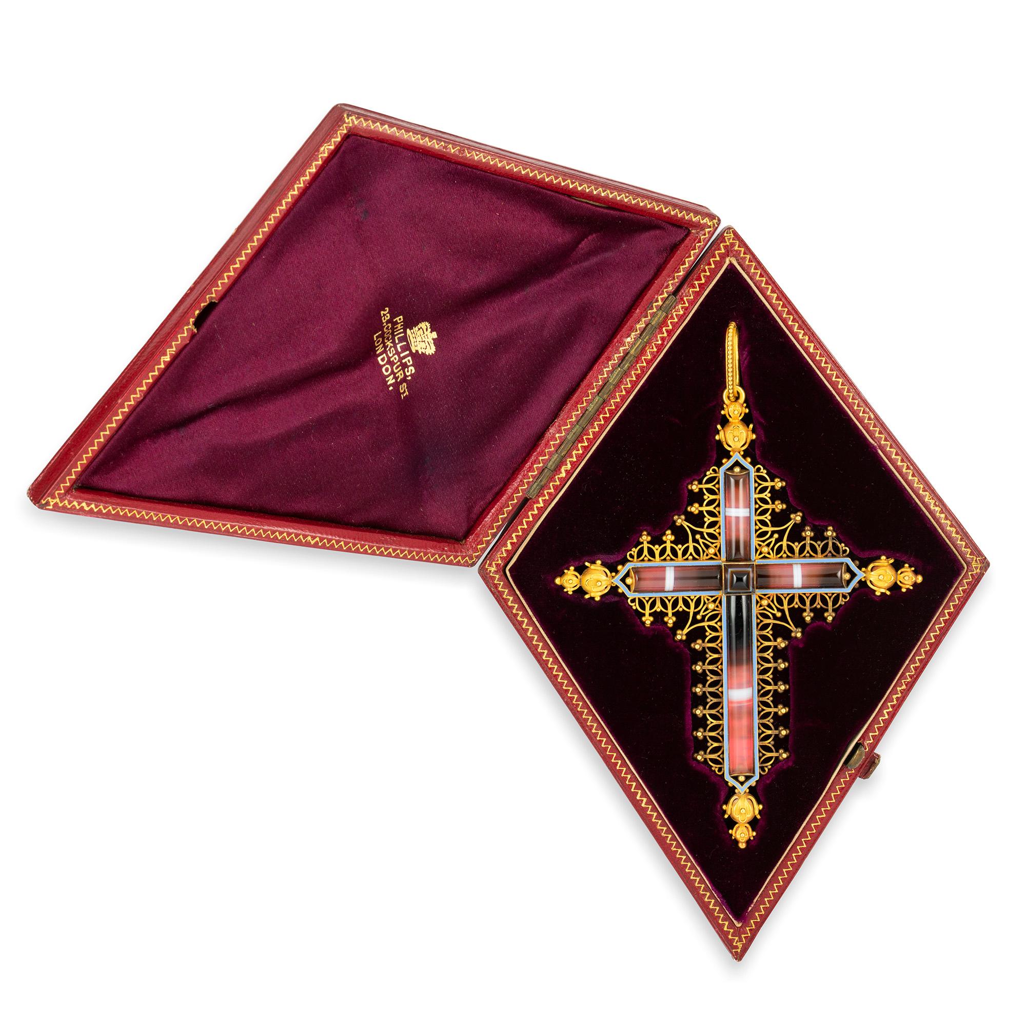 An Important Gothic Revival cross by Robert Phillips, the ornate gold cross set with a sugarloaf cut banded agate to the centre, the arms of the cross set with semi cylindrical-shaped banded agate, on a foiled-back setting, framed by lilac enamel,