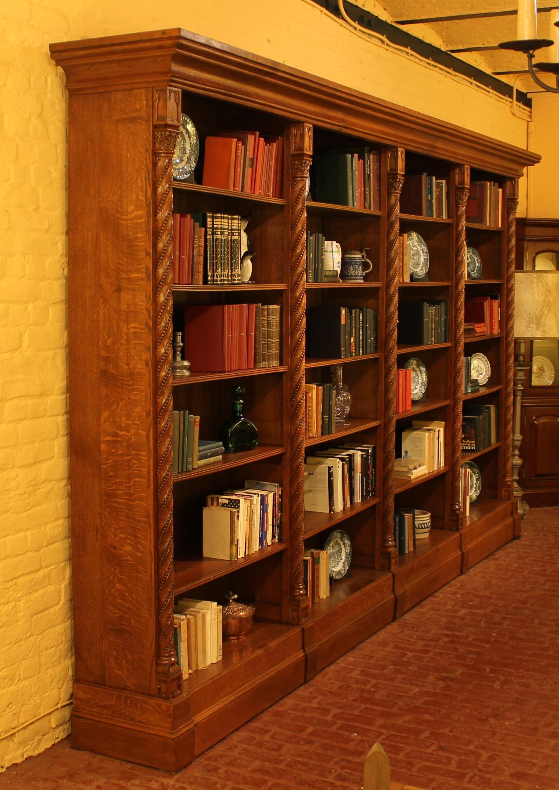 Large and unique Gothic revival open bookcase in oak from the 19th century, France

Very good quality 4m long Gothic revival library with its 5 salomic columns

The library has its original oak shelves and a rack which allows to adjust the