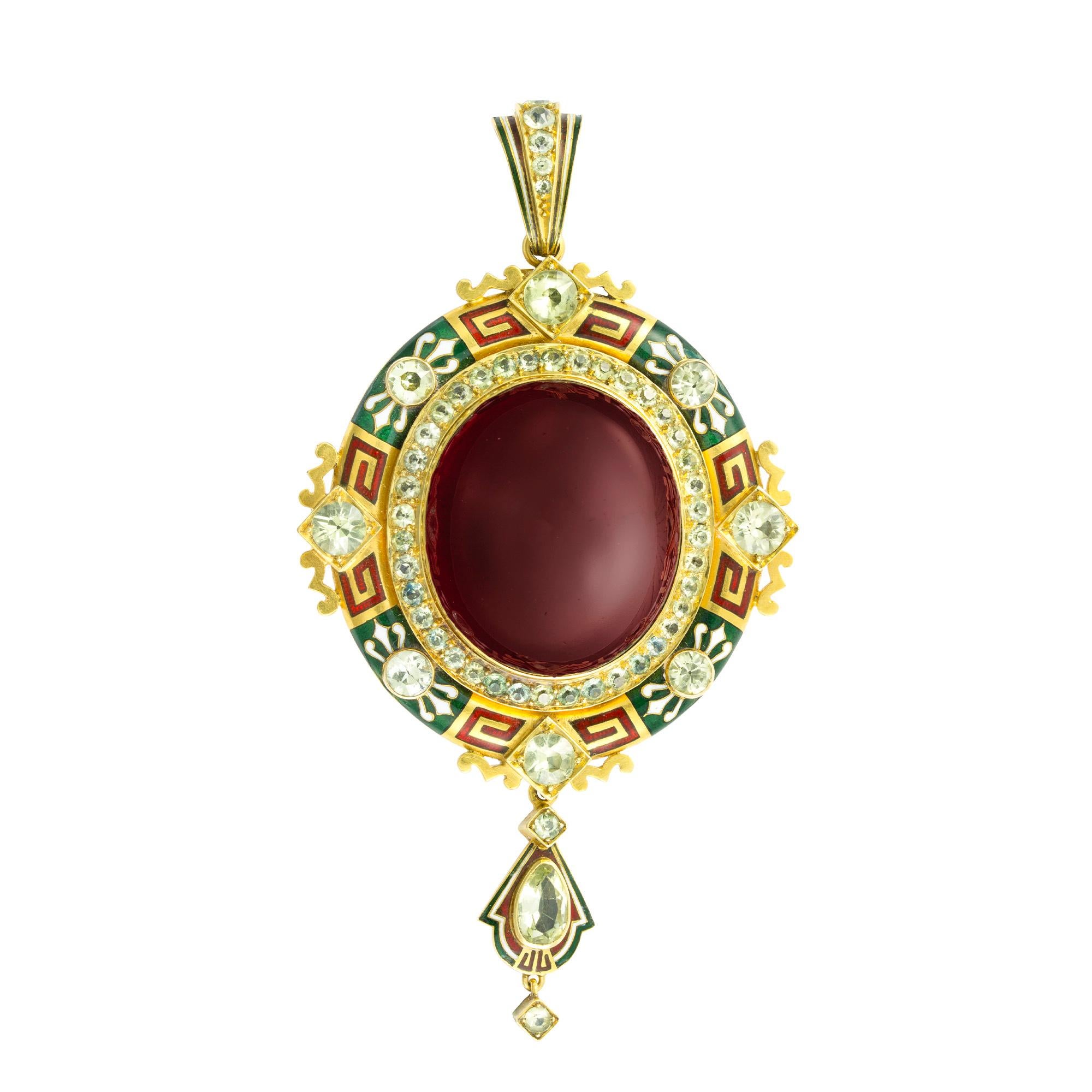 An important Holbeinesque garnet and enamel pendant, the large oval carbuncle garnet surrounded by a border of round faceted chrysolite and a further border of eight larger round faceted chrysolites in between a green, white and red enamel