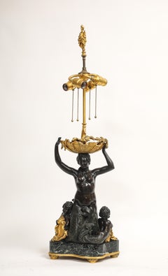 Un'importante lampada figurativa a forma di sirena in bronzo patinato e dorato di E. F. Caldwell