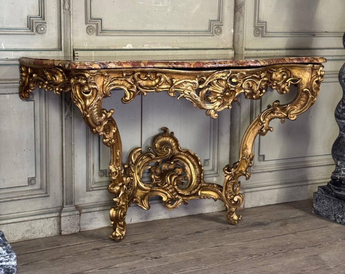 An important Louis XV carved and gilded wood and Breche d'Alep marble console table, 18th century France