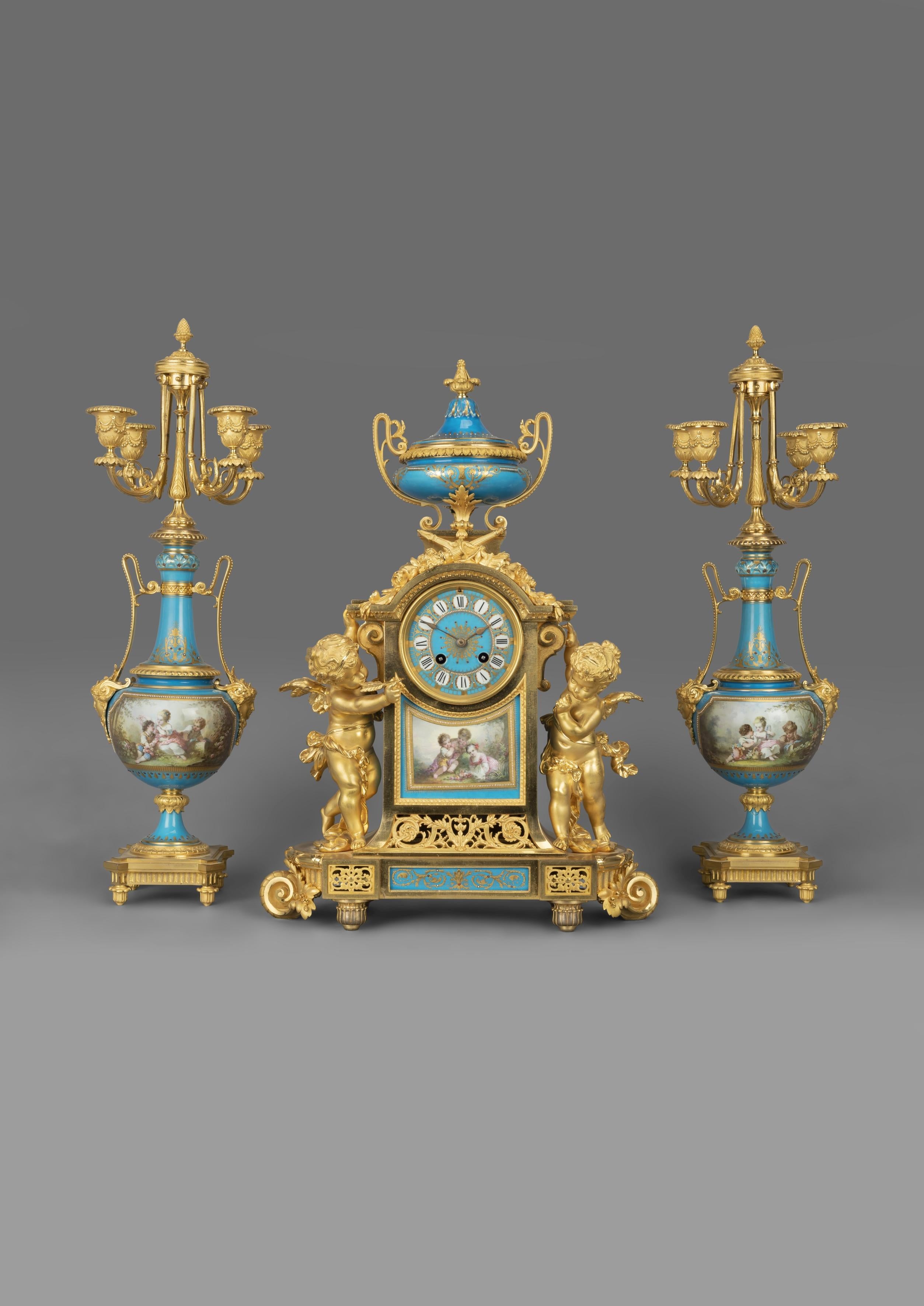 An important Napoléon III gilt bronze and turquoise porcelain clock garniture.

French, circa 1870. 

This very fine clock garniture comprises of a clock and a pair of vase form candelabra. 

The finely cast and chiselled gilt bronze case has