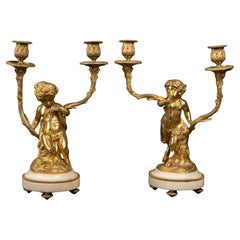 An important Pair of 19th Century Candelabra with Babies, Napoleon III Period