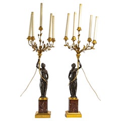 Important Pair of Black Patinated Bronze and Gilt Bronze Candelabras