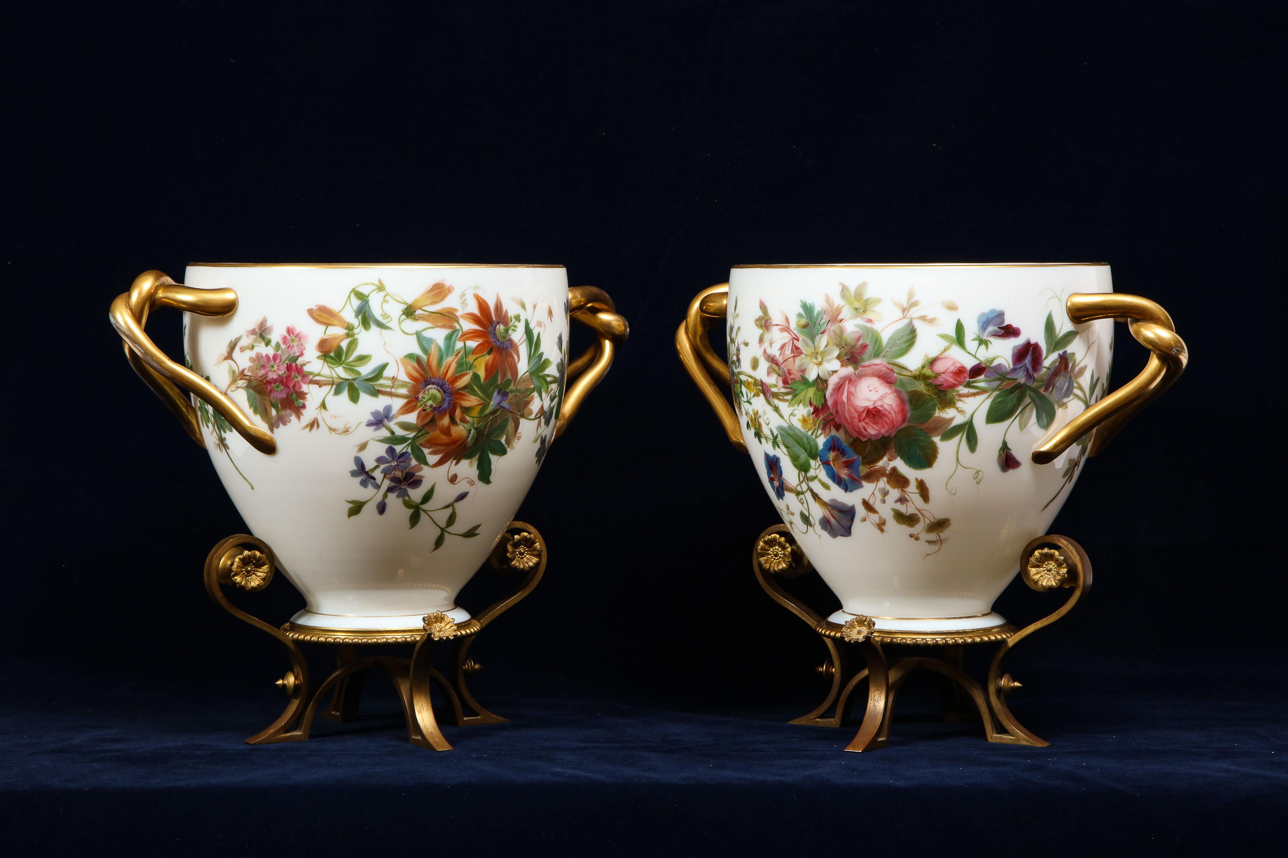 An extraordinary pair of Ormolu-Mounted enamel hand-painted white opaline vases/planters/jardinieres with gorgeous floral decorations most probably for the Paris Exposition Universelle, signed and dated Baccarat 10th of July 1866. This exceptional