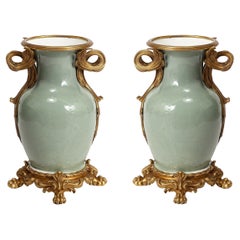 An Important Pair of French Ormolu-Mounted Chinese Celadon-Glazed Urns