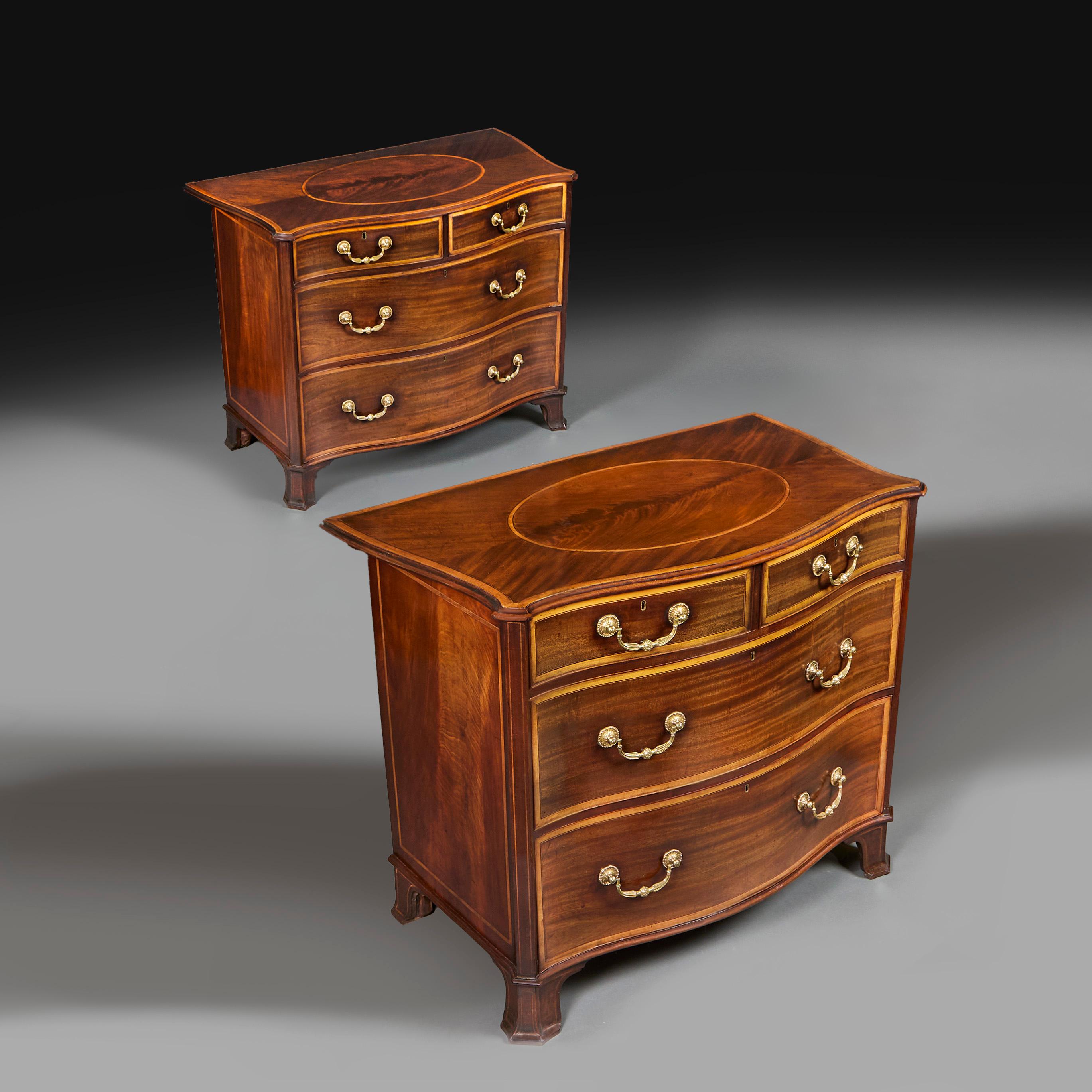 England, circa 1790

A fine pair of late eighteenth century mahogany serpentine commodes, the tops with satinwood crossbanding, each with a central oval medallion of fine mahogany flame veneer. With graduated drawers, two short drawers above two