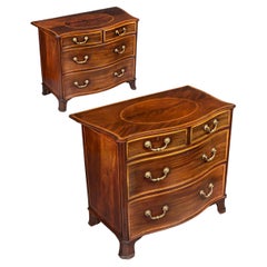 An Important pair of George III Serpentine Commodes