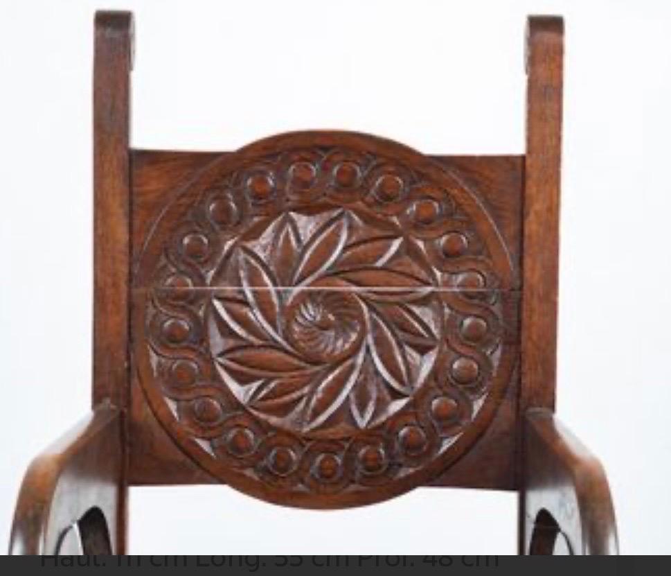 Mid-Century Modern an important sculpted armchairs in oak by Jacques PHILIPPE For Sale