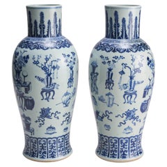 An imposing (59cm in height) pair of 19th C baluster-form blue and white vases
