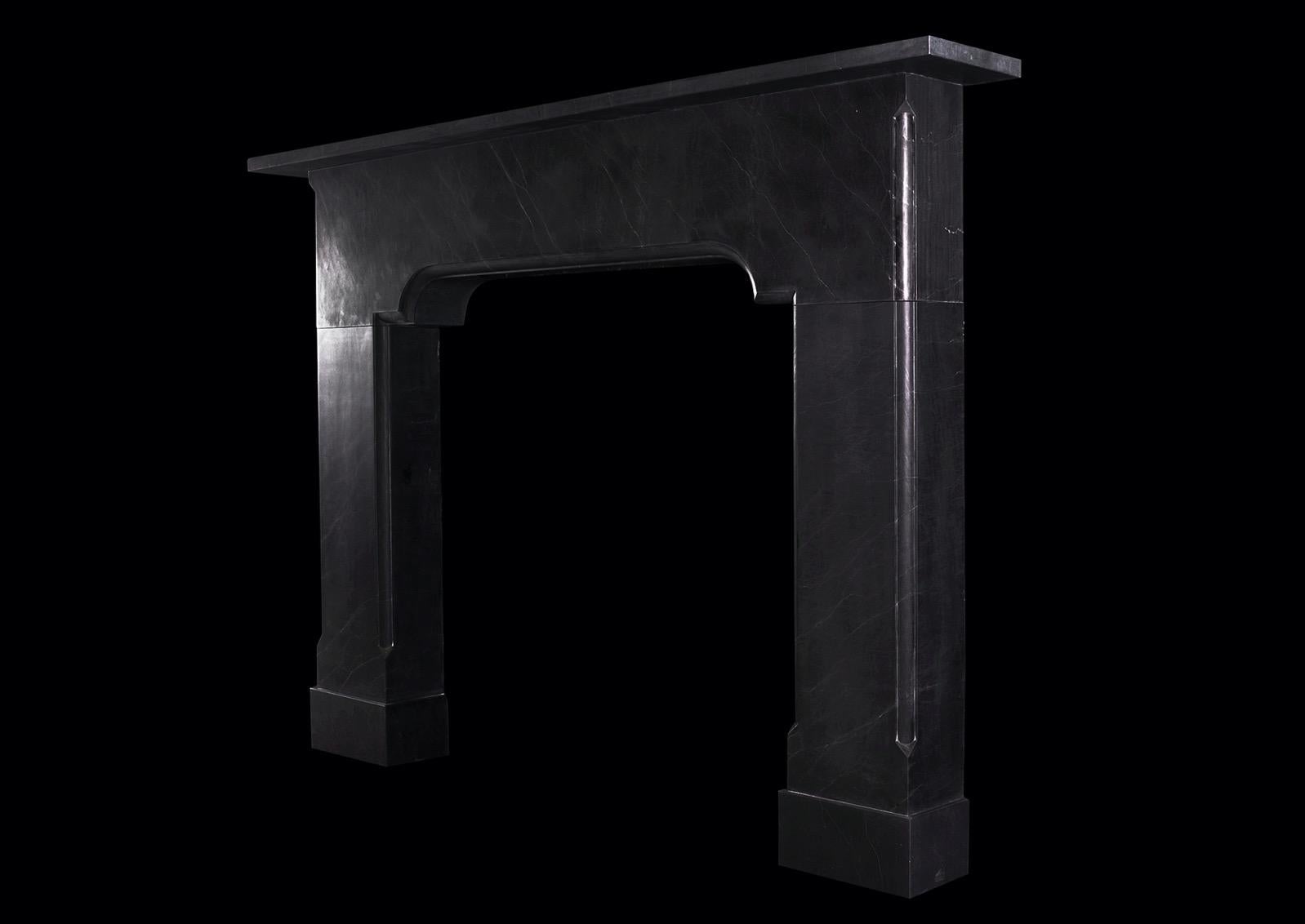 A large and imposing architectural black marble fireplace. The arched frieze with moulding to base, surmounted by plain shelf. Some fine pencil-veining throughout. A substantial piece. Modern. 

Shelf Width:	2000 mm   |   	78 ¾