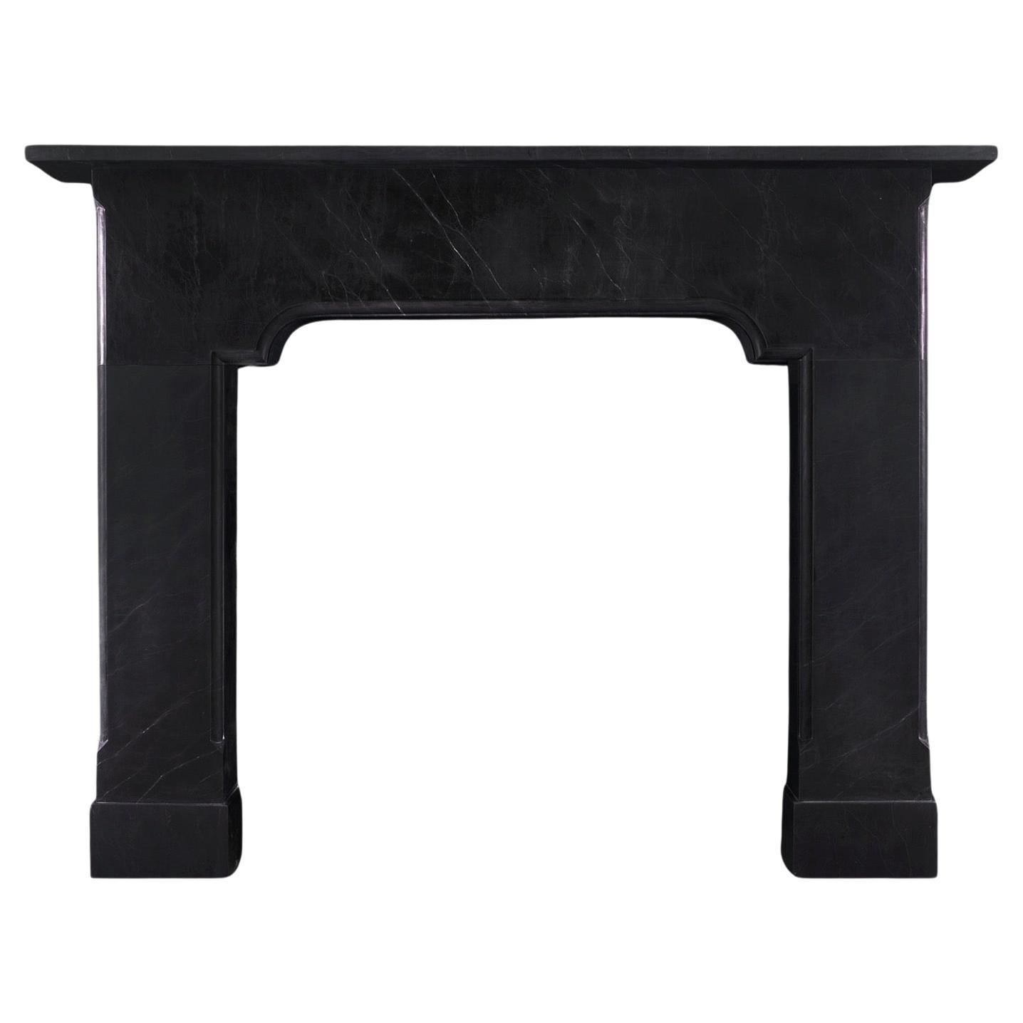 An Imposing Architectural Black Marble Fireplace 
