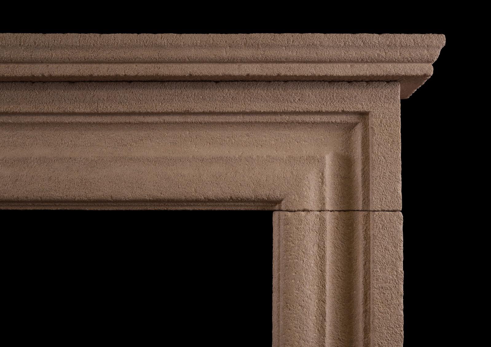 A large and imposing English moulded bolection fireplace in heavily antiqued Bath stone. Modelled on a chimneypiece originally housed in the Officer's Mess at Chelsea Barracks, London. Price includes a honed Bathstone hearth -  1965mm x 400mm x 40mm