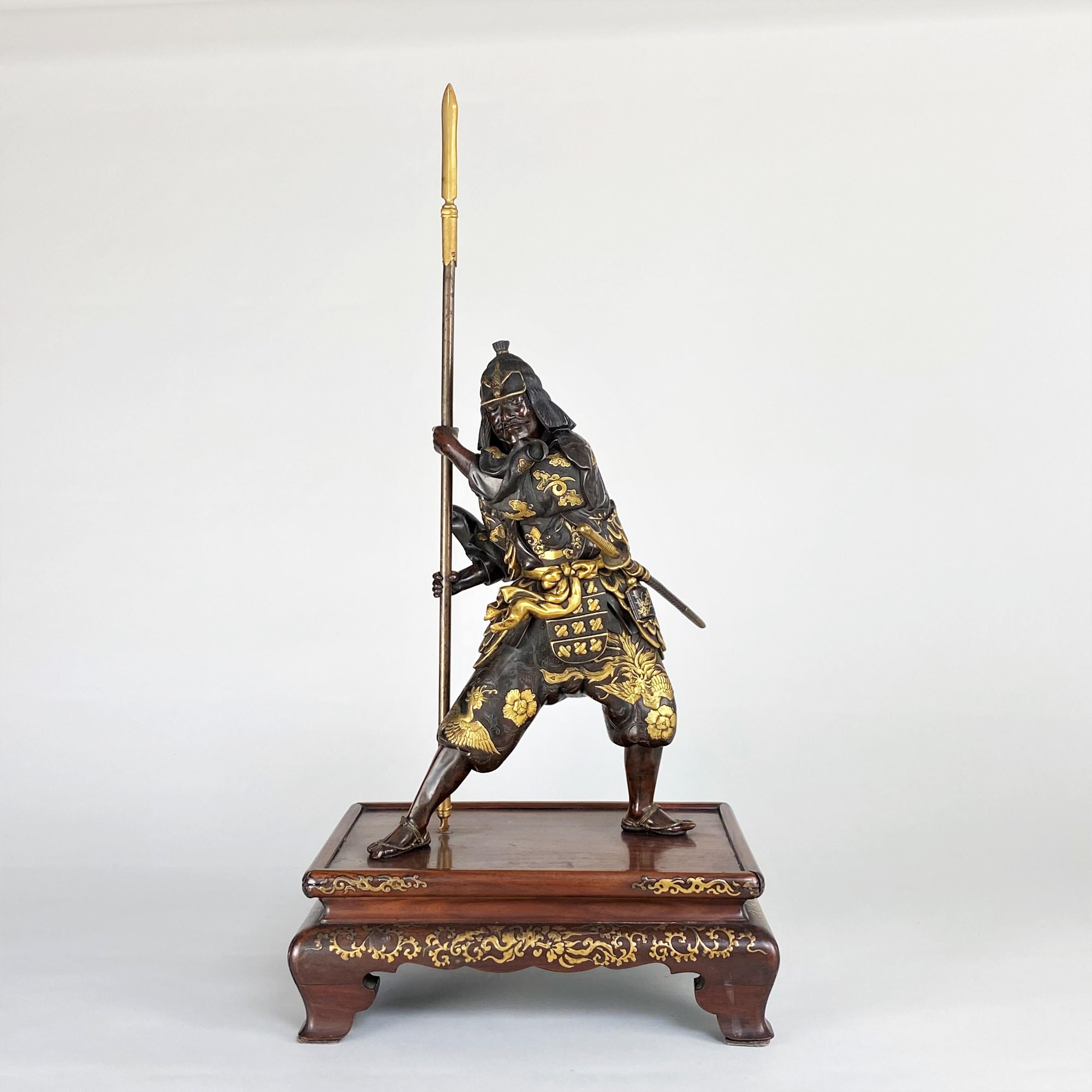 A wonderful Japanese Meiji-era, (1868 - 1912) Bronze Okimono depicting a Samurai. Signed by Miyao and with the trademark, fine quality wood and Gold lacquer stand, the figure stands in combative pose. He is holding his Yari (Long Spear of the