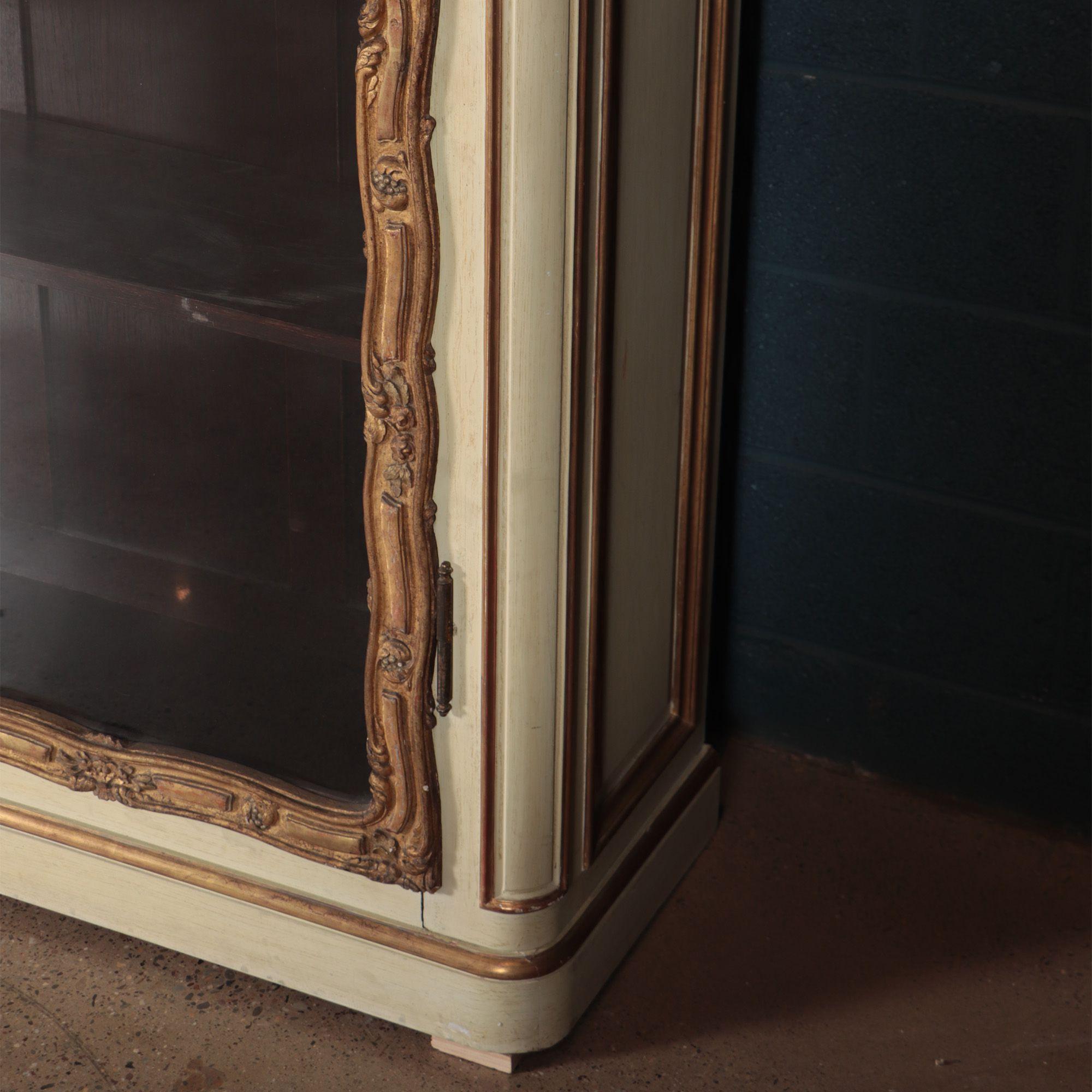 Painted An imposing pair of cream painted and parcel gilt large bookcases, French, 19th  For Sale