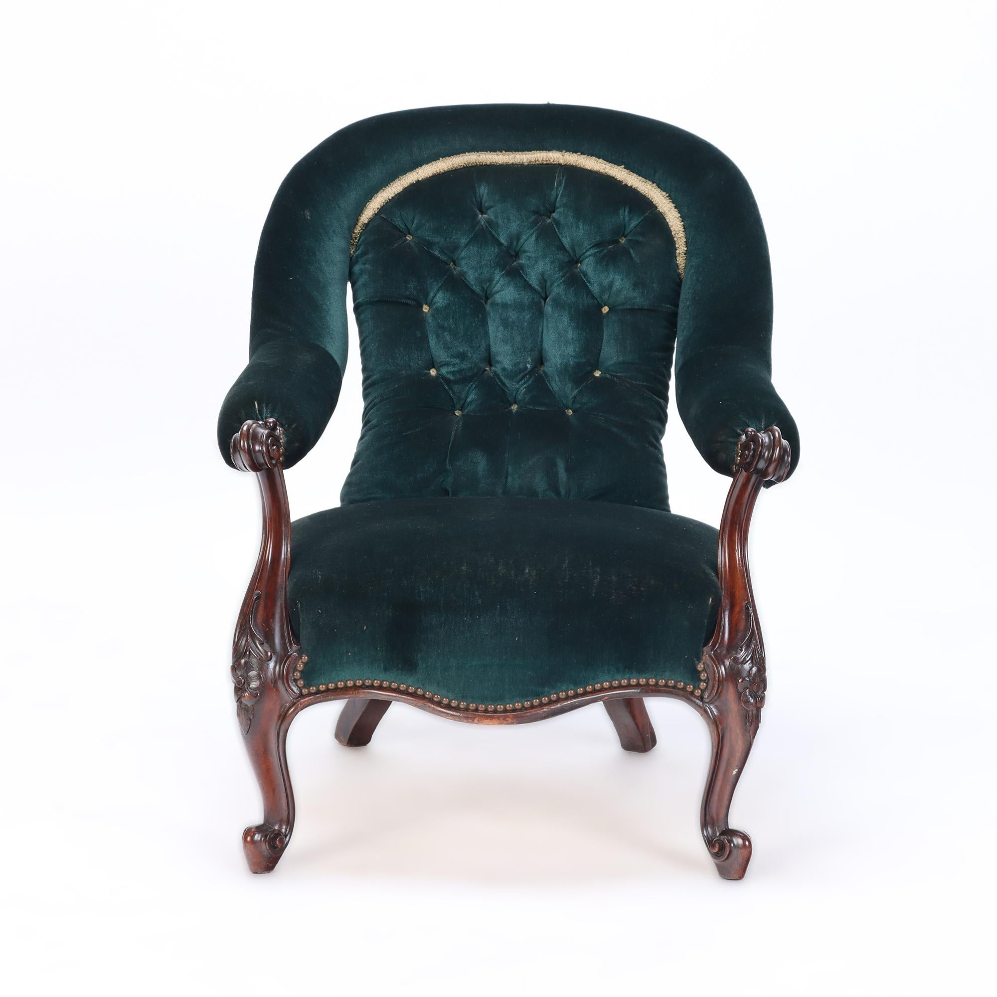 An imposing velvet upholstered library armchair with continuous arm, 19th C. The armchair would be incredible upholstered in leather.