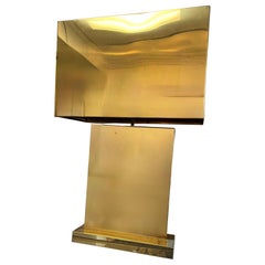 An impressive 1970s brass table lamp with brass shade signed C. Jere