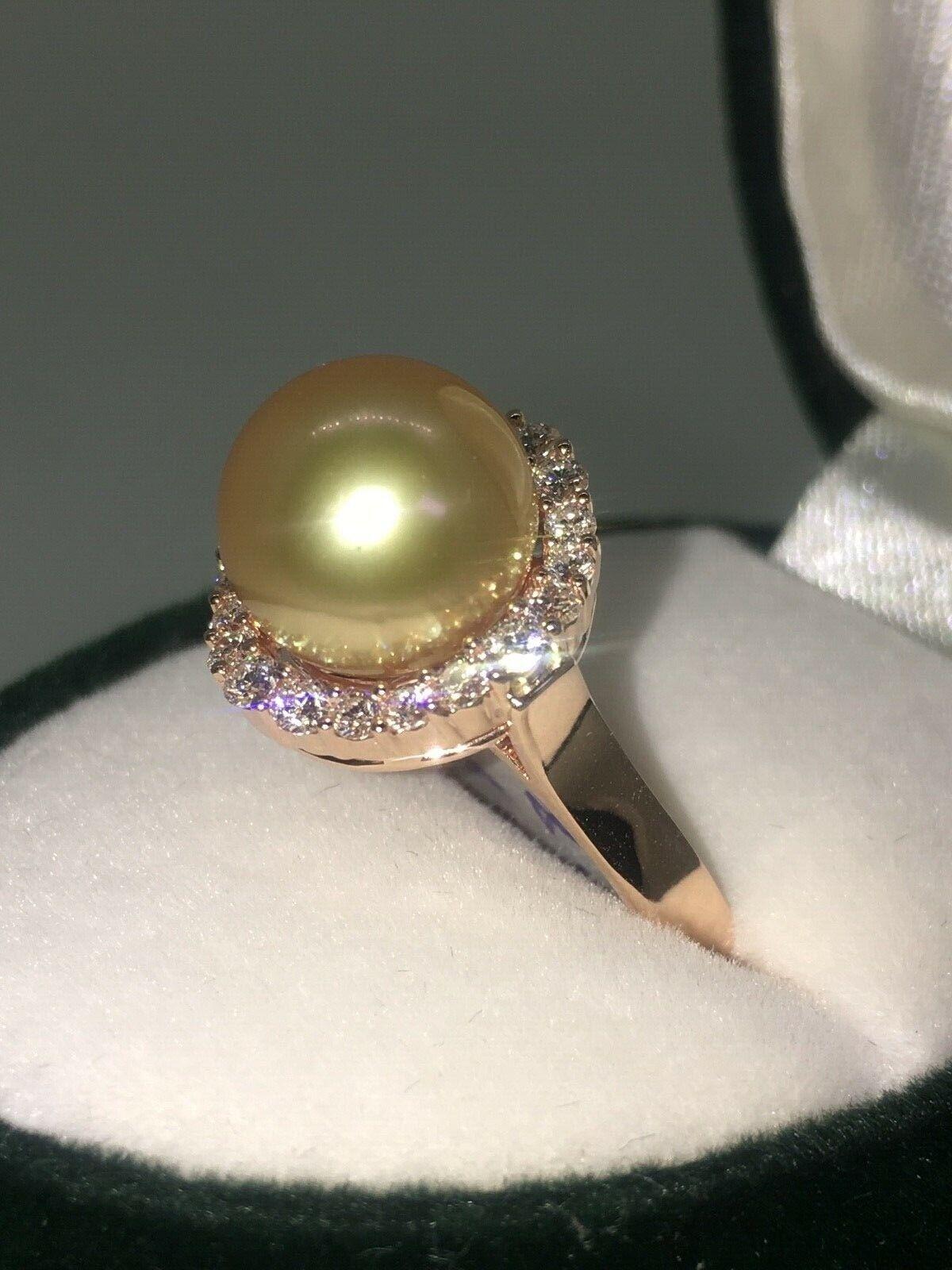 Centrally set with perfectly round South Sea Pearl of AAA quality, 
of Golden color & a very high, mirror-like luster
of 9.6mm 

Surrounded by the row of round brilliant cut diamonds (20) of E color, VVS clarity 
of 1.10ct in total approx. 

Mounted
