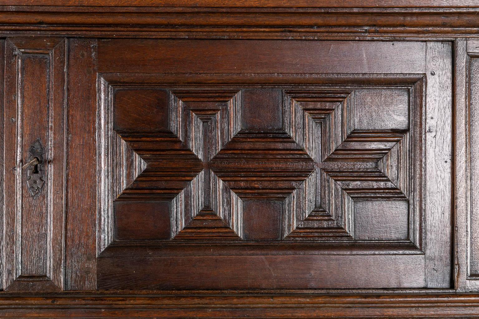 An impressive early 18th century Dutch oak geometric kussen cabinet with integra For Sale 3